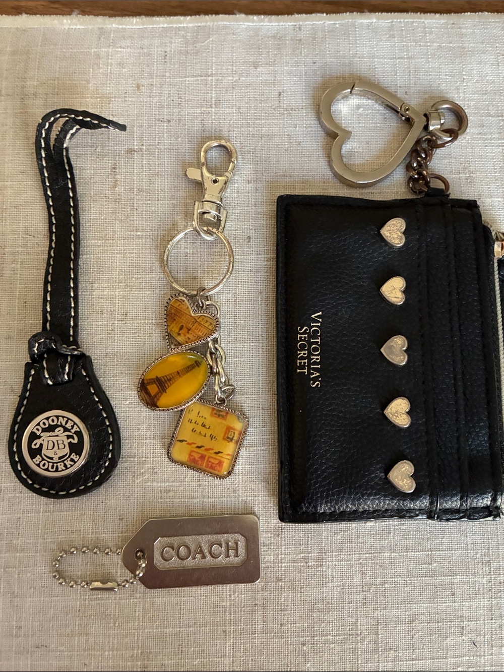 Set of 4 Charms:  COACH , DOONEY & BOURKE ,Victoria Secret  & AAI France Charm